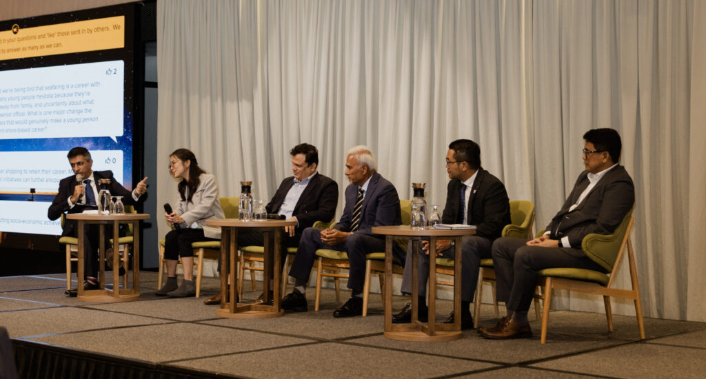 Panel of six maritime industry leaders on stage discussing "Seafaring as a Career" at the Nautical Institute Singapore Conference 2026, including Capt. Kyaw Swar Htet, Head of Crewing at Norstar Ship Management