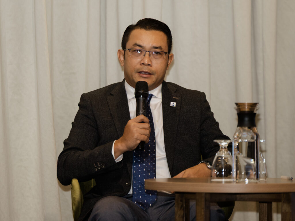 Capt. Kyaw Swar Htet, Head of Crewing at Norstar Ship Management, speaking on stage at the Nautical Institute Singapore Conference 2026